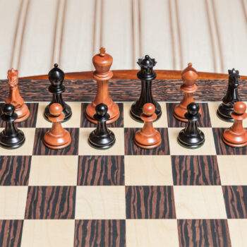 1849 Staunton ebony and antiqued boxwood pieces arranged on the 60 cm Andalucia board