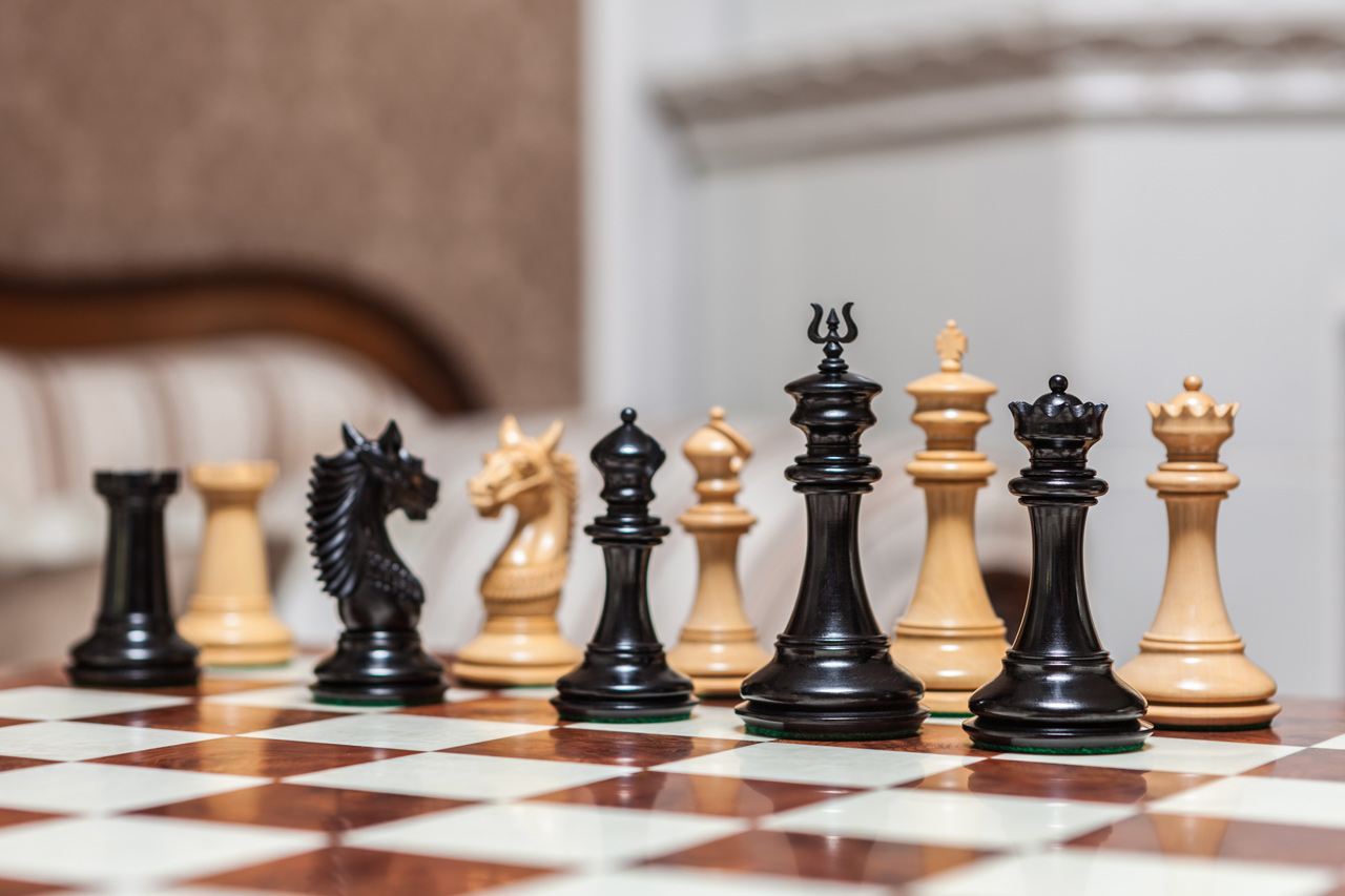 The Apollo chess pieces (Ebony and Boxwood) on the 60 cm Toscana board The Apollo Series Chess Pieces in Ebony and Boxwood