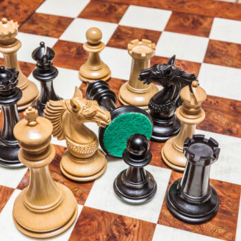 Shown with: 60 cm Toscana chess board Overhead close-up of Apollo ebony and boxwood chess pieces on the 60 cm Toscana chess board