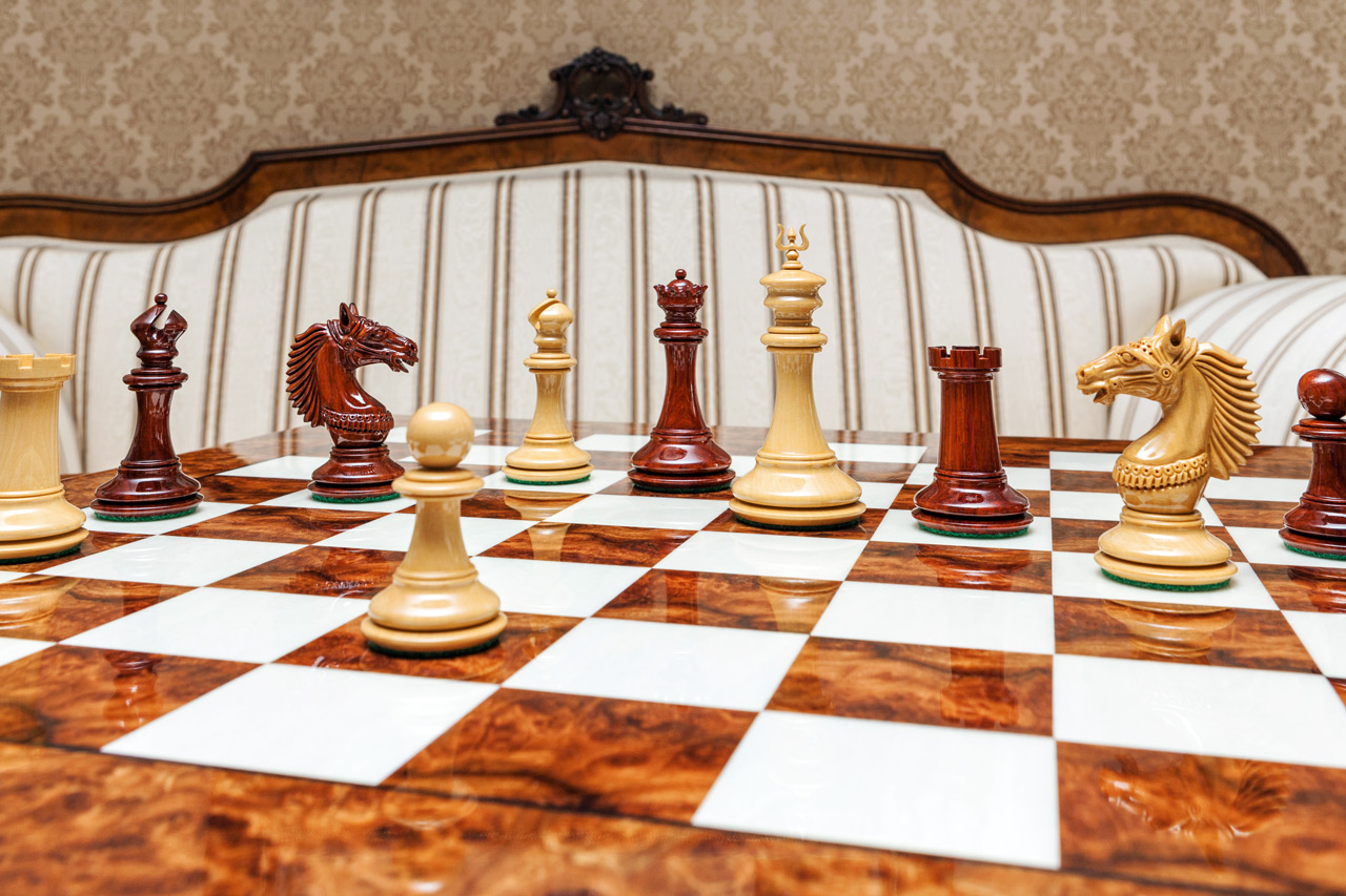 The Apollo Series chess pieces (Lacquered Padauk and Boxwood) on the 60 cm Da Vinci board The Apollo Series 4.4 inches Chessmen in Lacquered Padauk and Boxwood