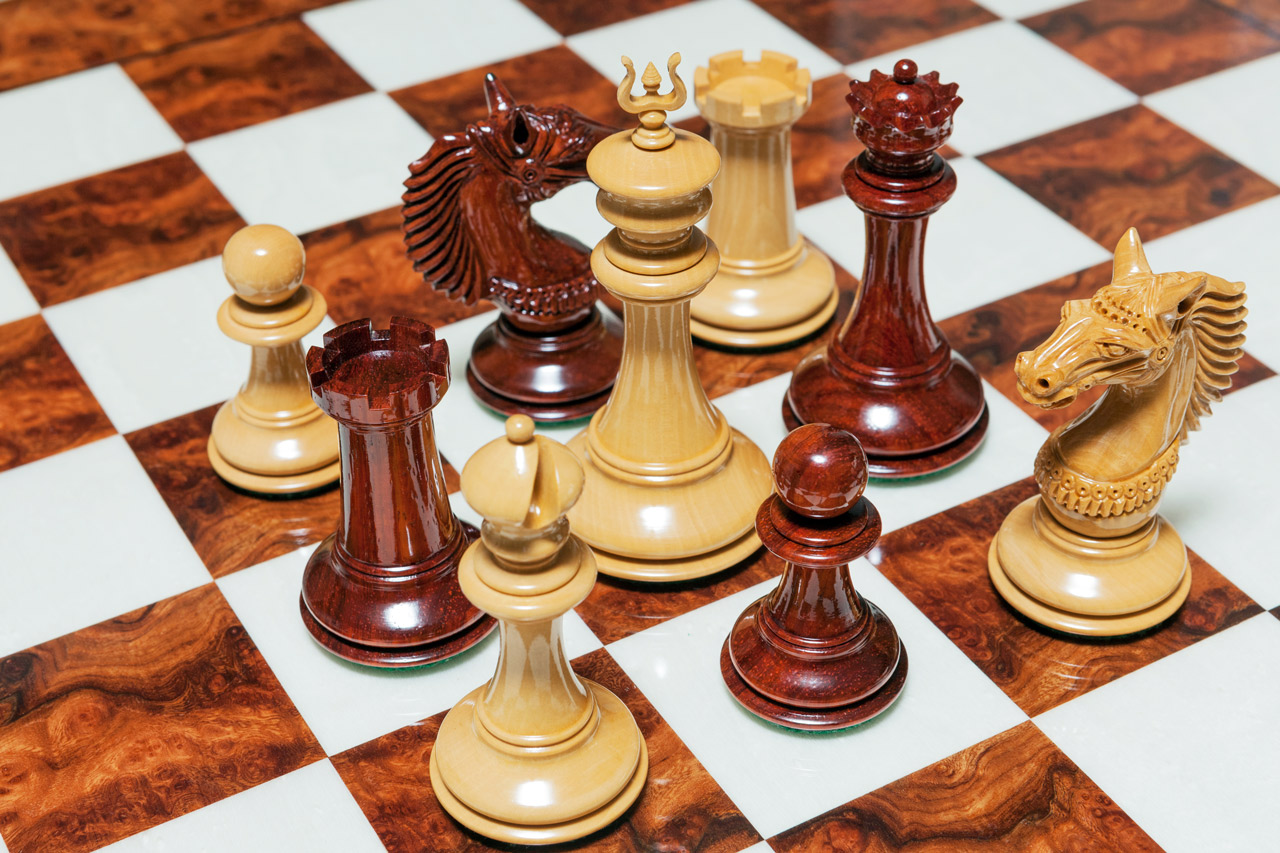 The Apollo Series chess pieces (Lacquered Padauk and Boxwood) on the 60 cm Da Vinci board The Apollo Series 4.4 inches Chessmen in Lacquered Padauk and Boxwood