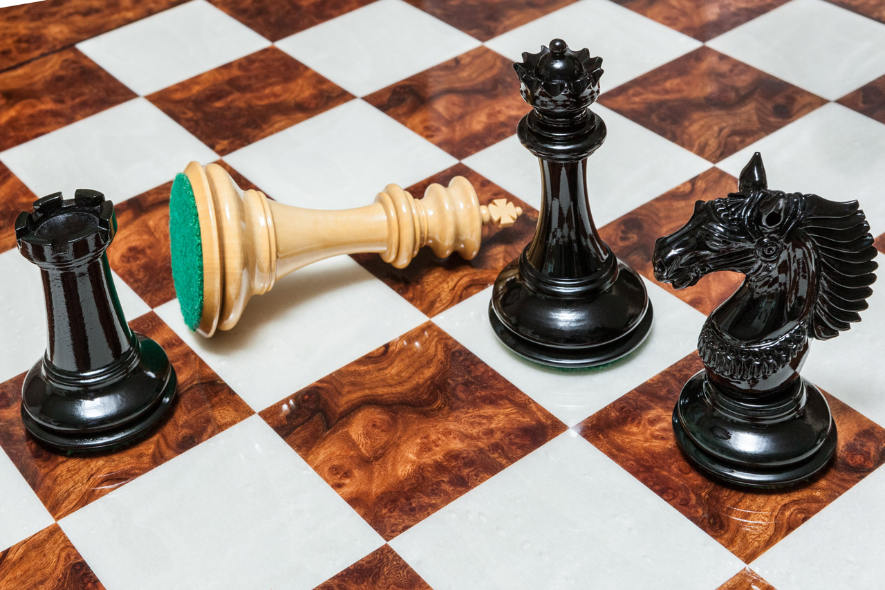 The Apollo chess pieces (Lacquered Ebony and Boxwood) on the 60 cm Da Vinci board The Apollo Series Chess Pieces in Lacquered Ebony and Boxwood