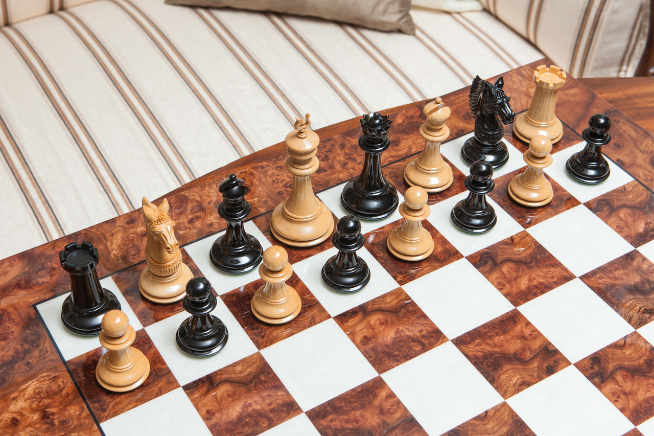 The Apollo chess pieces (Lacquered Ebony and Boxwood) on the 60 cm Da Vinci board The Apollo Series Chess Pieces in Lacquered Ebony and Boxwood