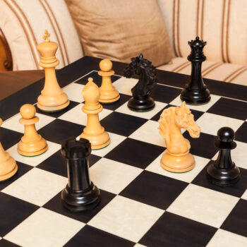 Florence ebony and boxwood pieces in an endgame position on the Asturias board