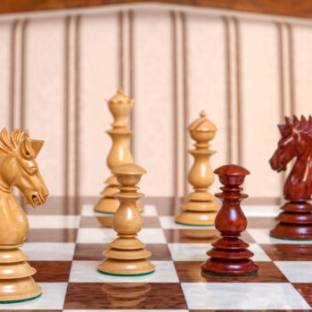 Close-up of a boxwood Dali knight and padauk pieces on the Segovia board