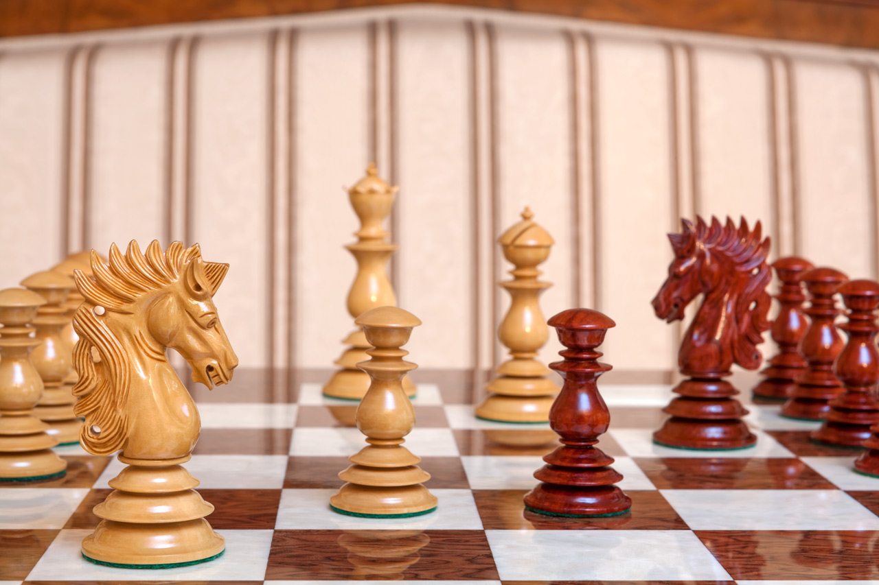 Girona chess set with a brown ash burl board
