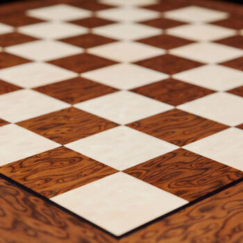 Angled close-up of the 50 cm Cordoba brown ash burl chess board