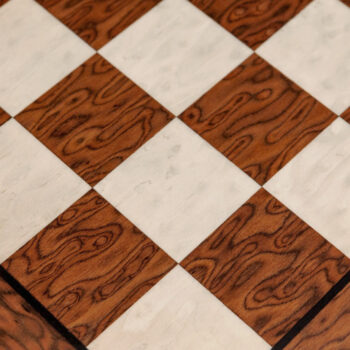 Close-up of the squares and border of the 50 cm Cordoba brown ash burl chess board