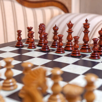 Shown with: 60 cm Asturias chess board Dali lacquered padauk and boxwood chess pieces lined up on the 60 cm Asturias chess board