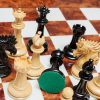 The Duke chess pieces (Lacquered Ebony and Boxwood) on the 60 cm Da Vinci board Duke 4.4 inch chess pieces in Lacquered Ebony and Boxwood
