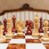 The Duke chess pieces (Lacquered Padauk and Boxwood) on the 60 cm Da Vinci board Duke 4.4 inch chess pieces in Lacquered Padauk and Boxwood