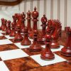 The Duke chess pieces (Lacquered Padauk) on the 60 cm Da Vinci board Duke 4.4 inch chess pieces in Lacquered Padauk