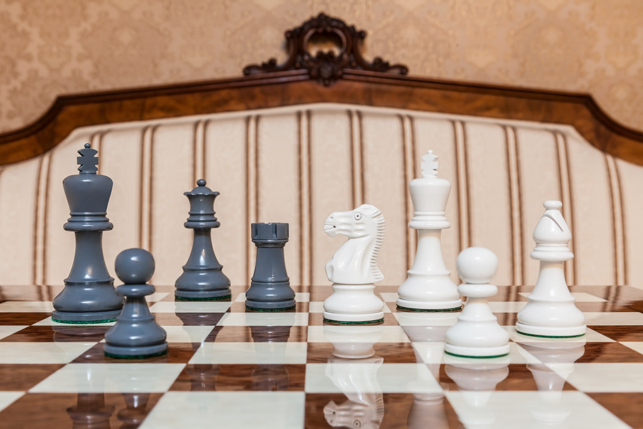 Earl Grey and White Chess Pieces on the red 50 cm ”Cordoba” Chess Board