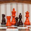 Earl Orange and Brown on the 50 cm Cordoba board Earl Orange and Brown Chess Pieces on the red 50 cm ”Cordoba” Chess Board