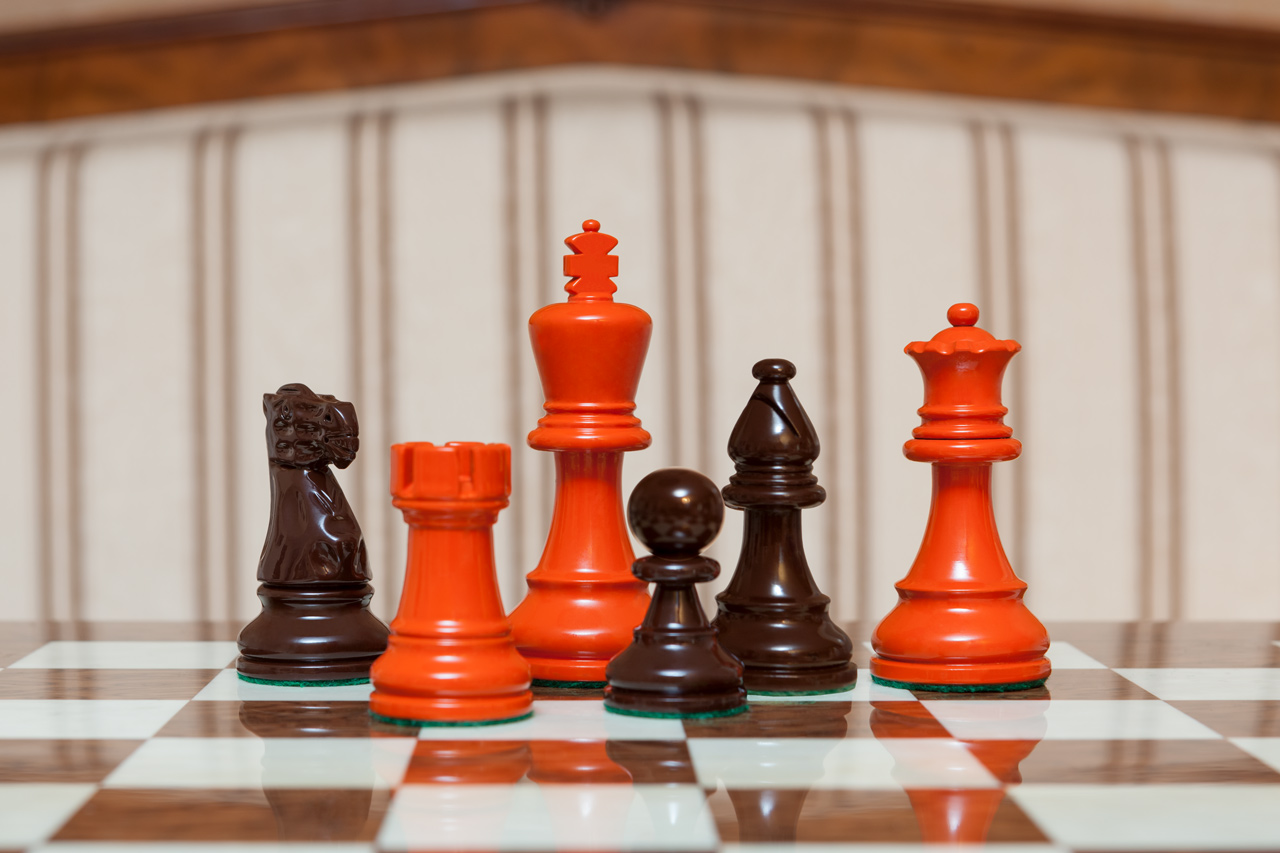 Earl Orange and Brown Chess Pieces on the red 50 cm ”Cordoba” Chess Board