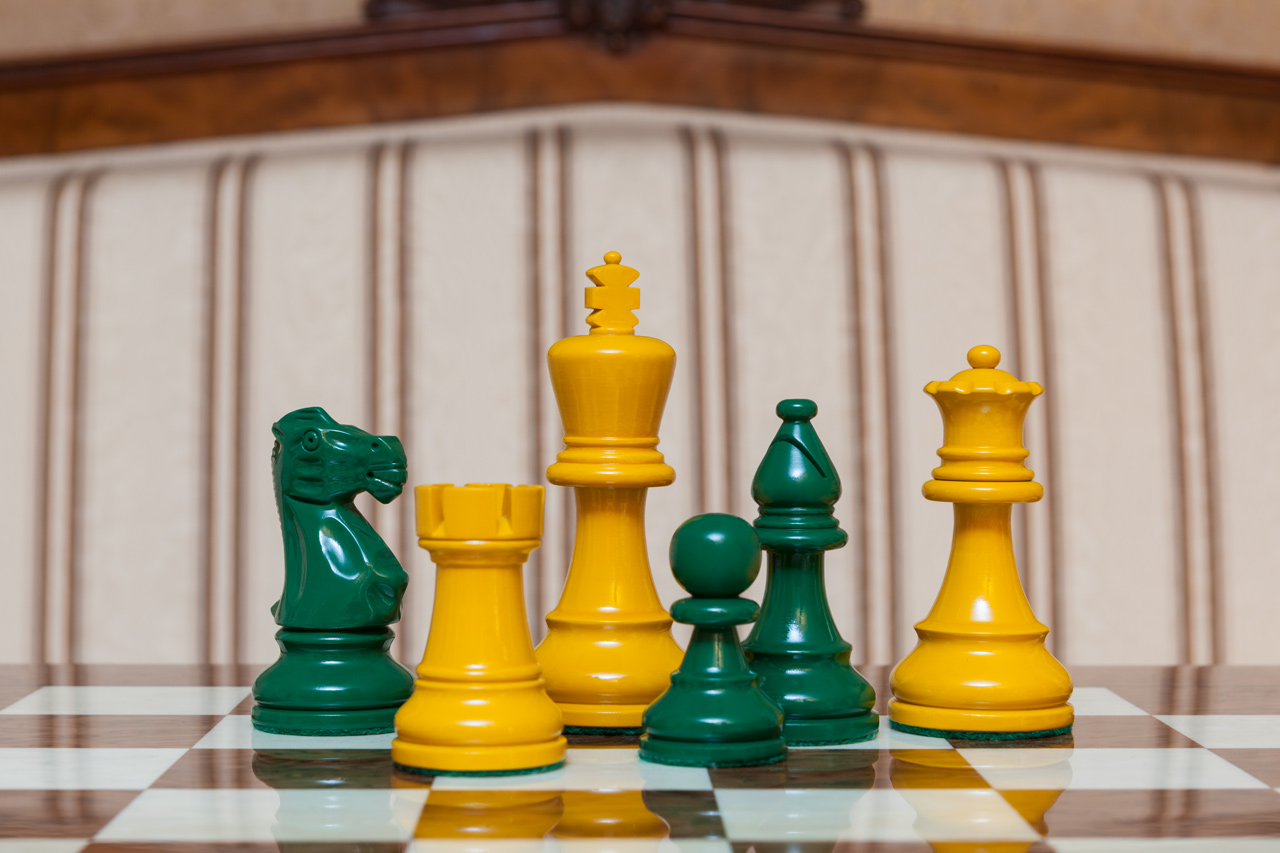 Earl Yellow and Green Chess Pieces on the red 50 cm ”Cordoba” Chess Board