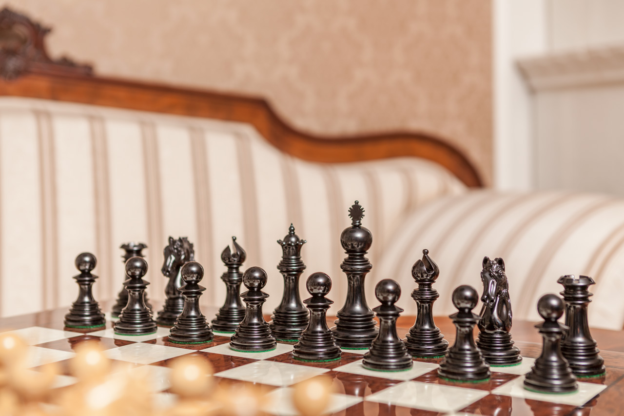 The Granada chess pieces (Lacquered Ebony and Boxwood) on the 60 cm Da Vinci board The Granada Luxury Chess Pieces in Boxwood and Ebony