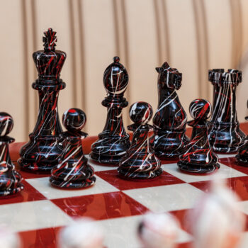 Close-up of the black New York pieces with red veining on the Bologna board