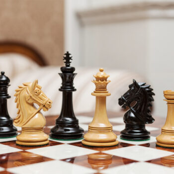 Regal lacquered ebony and boxwood chess pieces viewed at board level on the 60 cm Da Vinci chess board