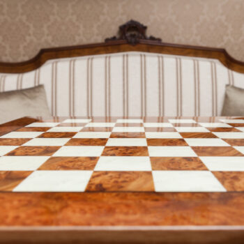 Venezia 51 cm high-gloss root of elm chess board in an interior setting