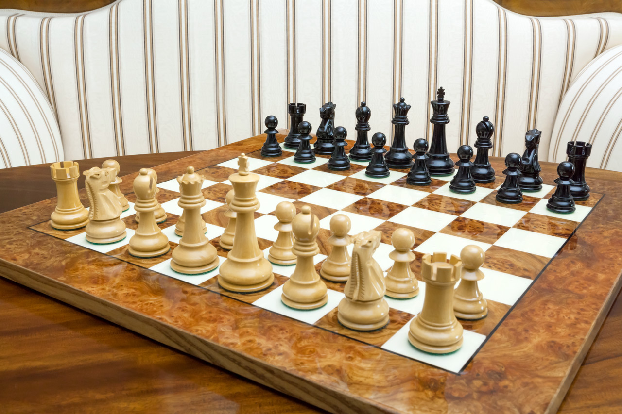 Saga chess set with a root of elm board
