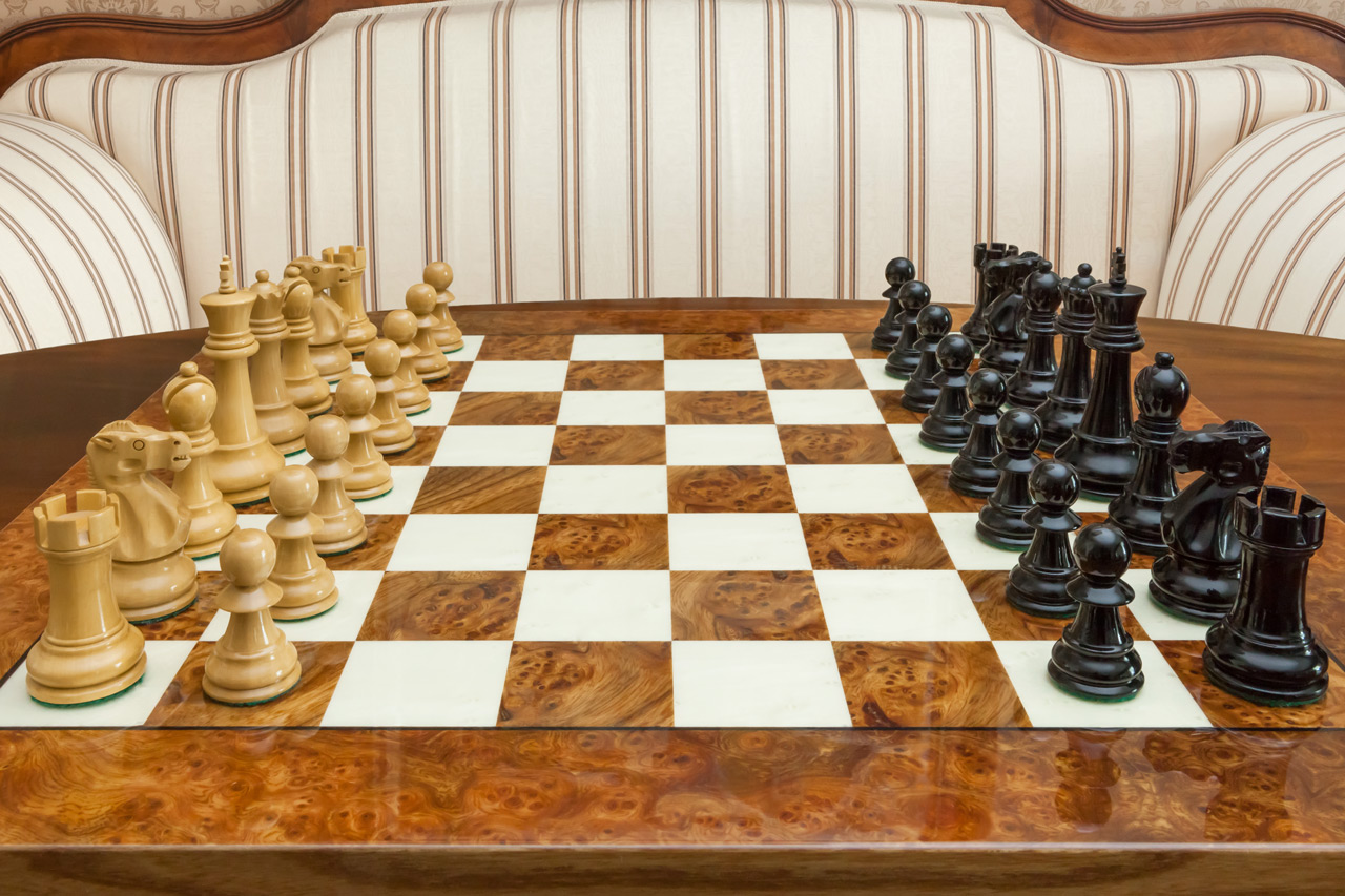 Saga chess set with a root of elm board