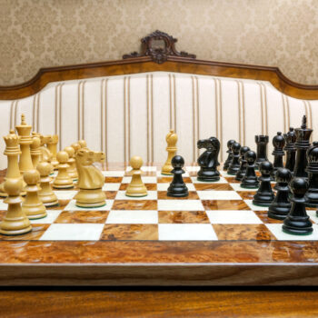 Viking ebony and boxwood pieces arranged for play on the Venezia board