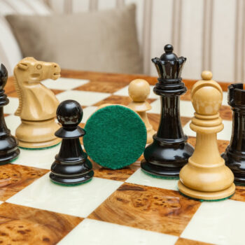 Viking ebony and boxwood pieces on the Venezia board, with one green felt base visible