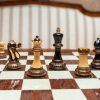 Vesuvius Chess Set with Burnt Boxwood pieces on a Spanish board