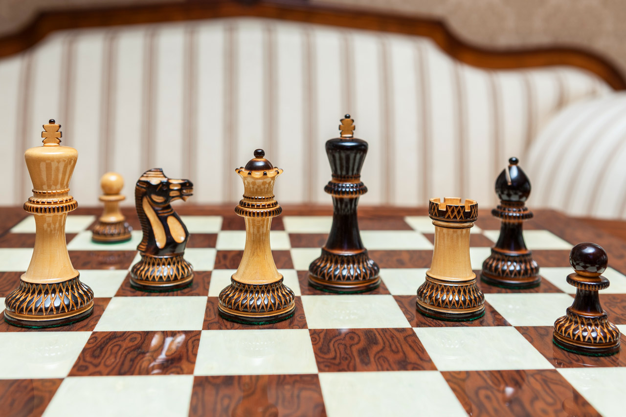 Vesuvius Chess Set with Burnt Boxwood pieces on a Spanish board