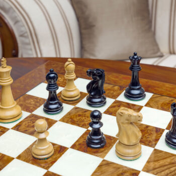 Shown with: 51 cm Venezia chess board High-angle view of Viking lacquered boxwood and ebony chess pieces on the 51 cm Venezia chess board