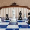 Earl Black and White chessmen on the 51 cm Capri board Black and White Earl chessmen on a blue board